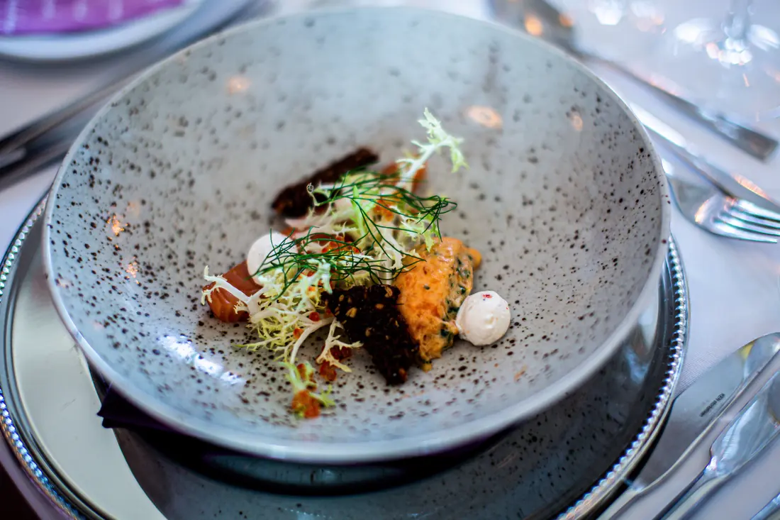 A plated dish with a herb garnish