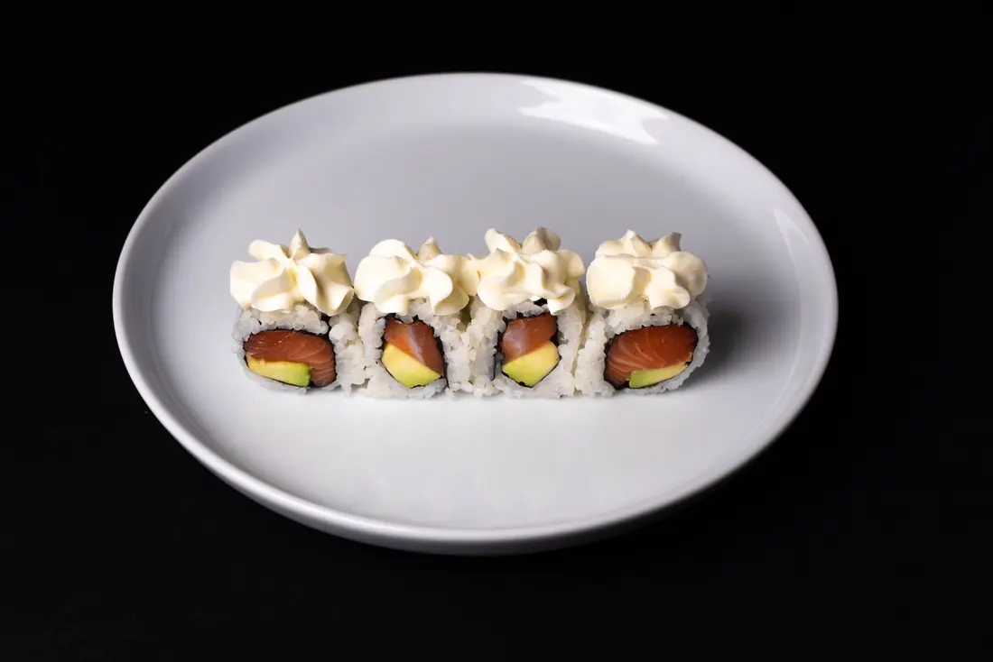 A roll finished with piped sauce