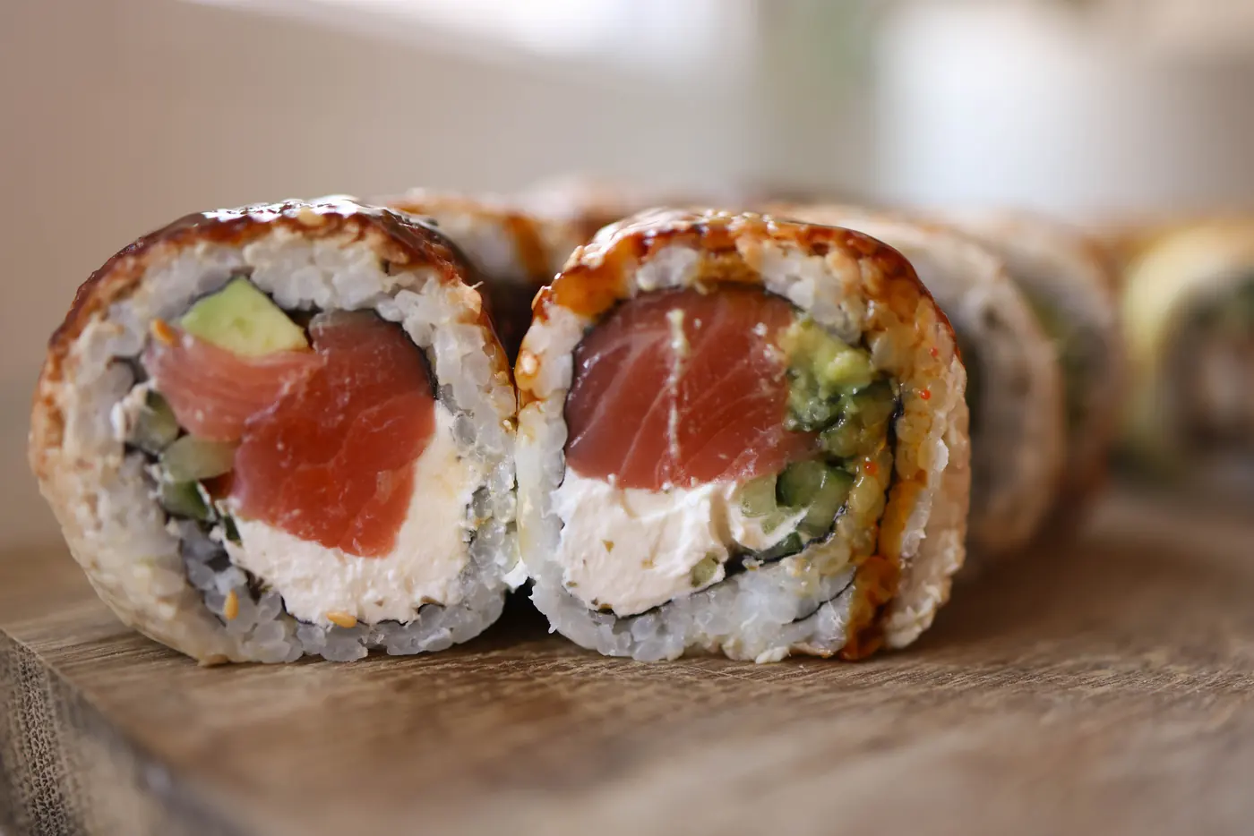 A sushi roll with a pale creamy filling
