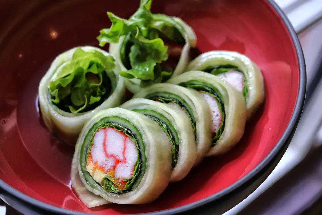 Rolls with greens poking out of them