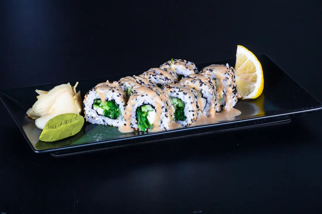 Rolls with the rice on the outside, sesame scattered over