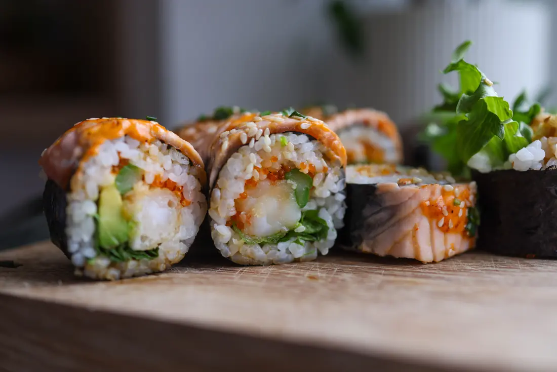 Prepared rolls lined up on a board
