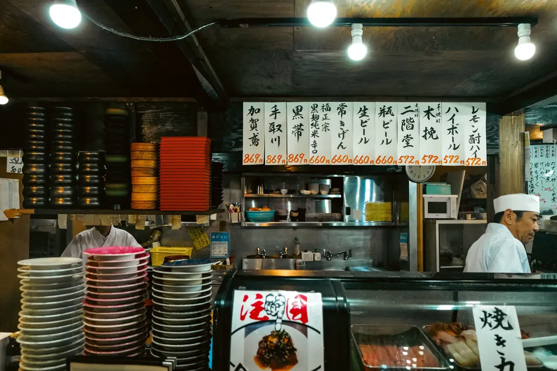 A counter with stacked coloured plates