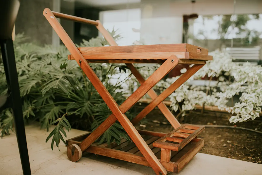 A wooden serving cart