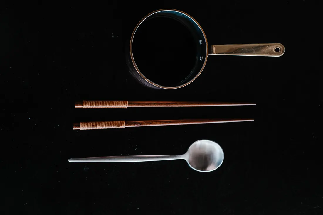 Chopsticks and a spoon laid out