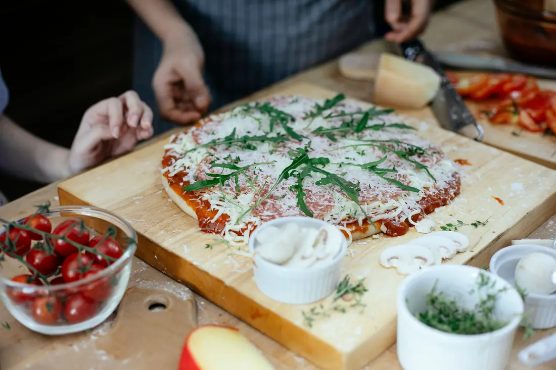 Tomatoes and grated cheese on a board
