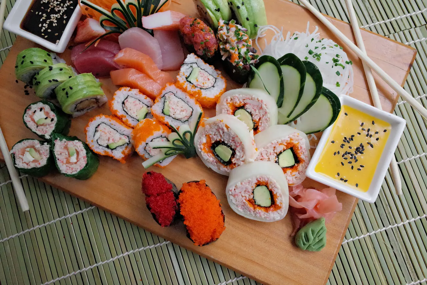 An assortment of rolls on a wooden board