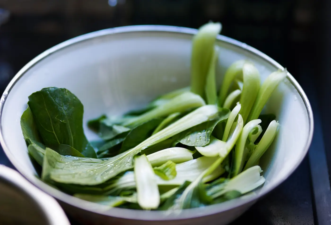 Bok choy in a white bowl