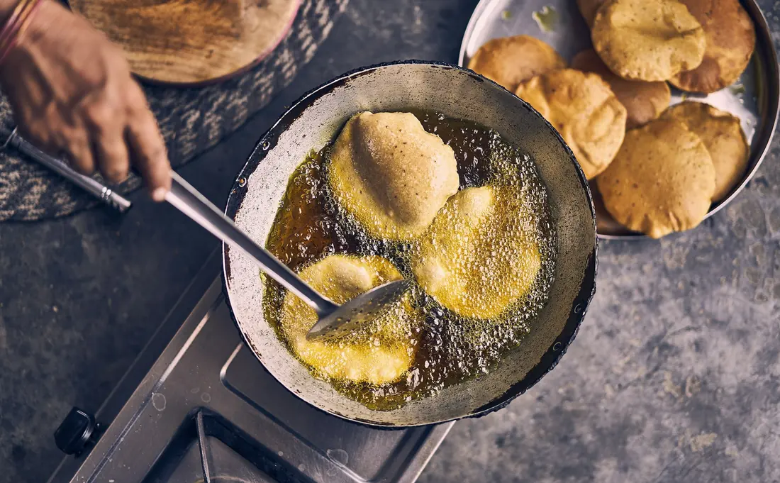 Food frying in a pan of hot oil