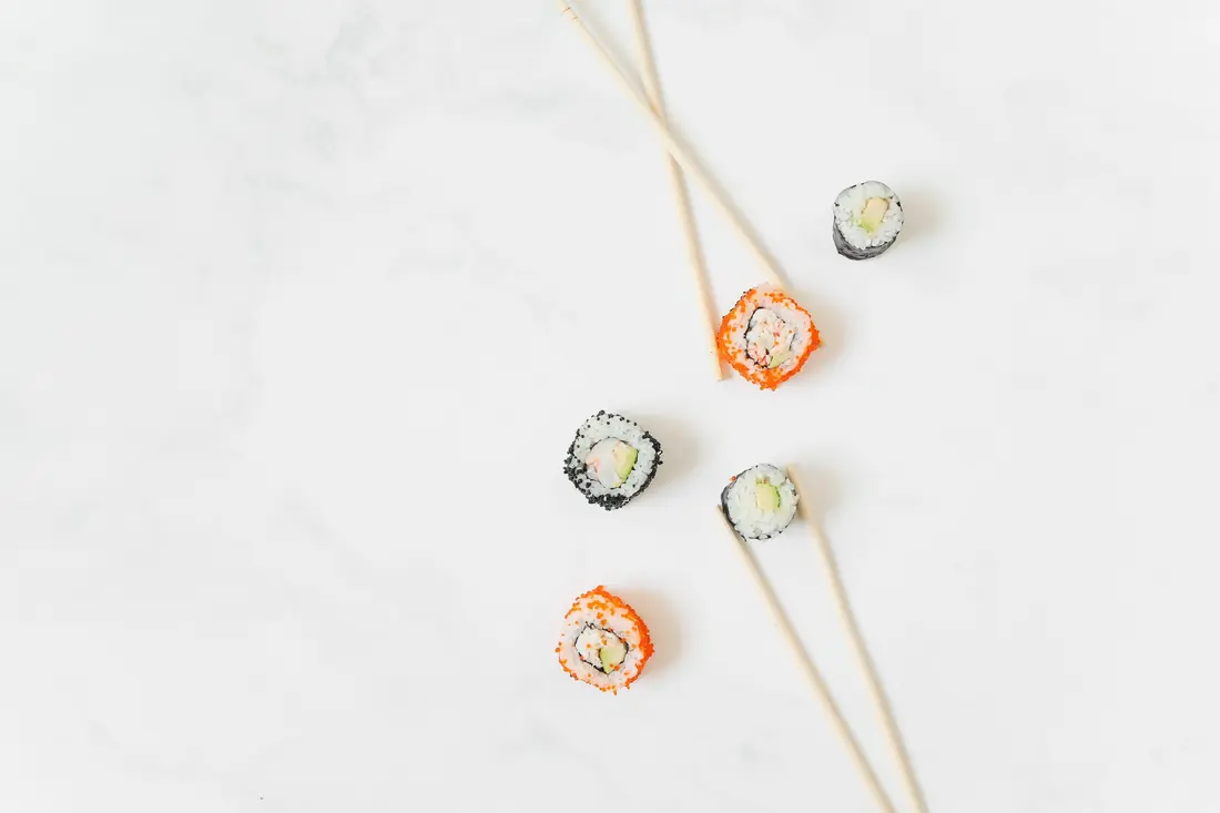 Small maki pieces laid out on a pale surface