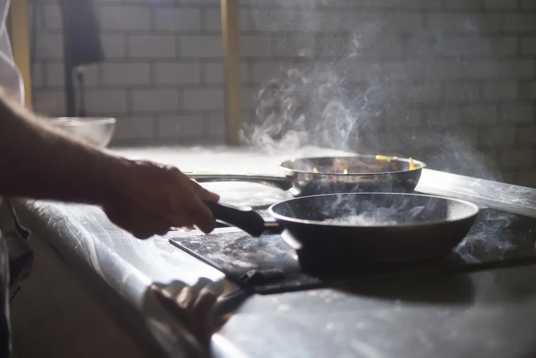 Pans and steam on a restaurant range