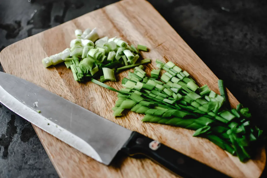Chopped green vegetables on a board
