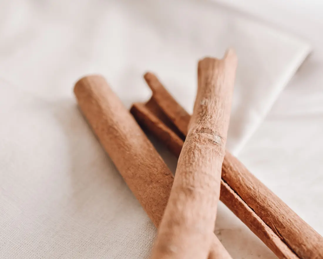 Cinnamon sticks on a pale cloth