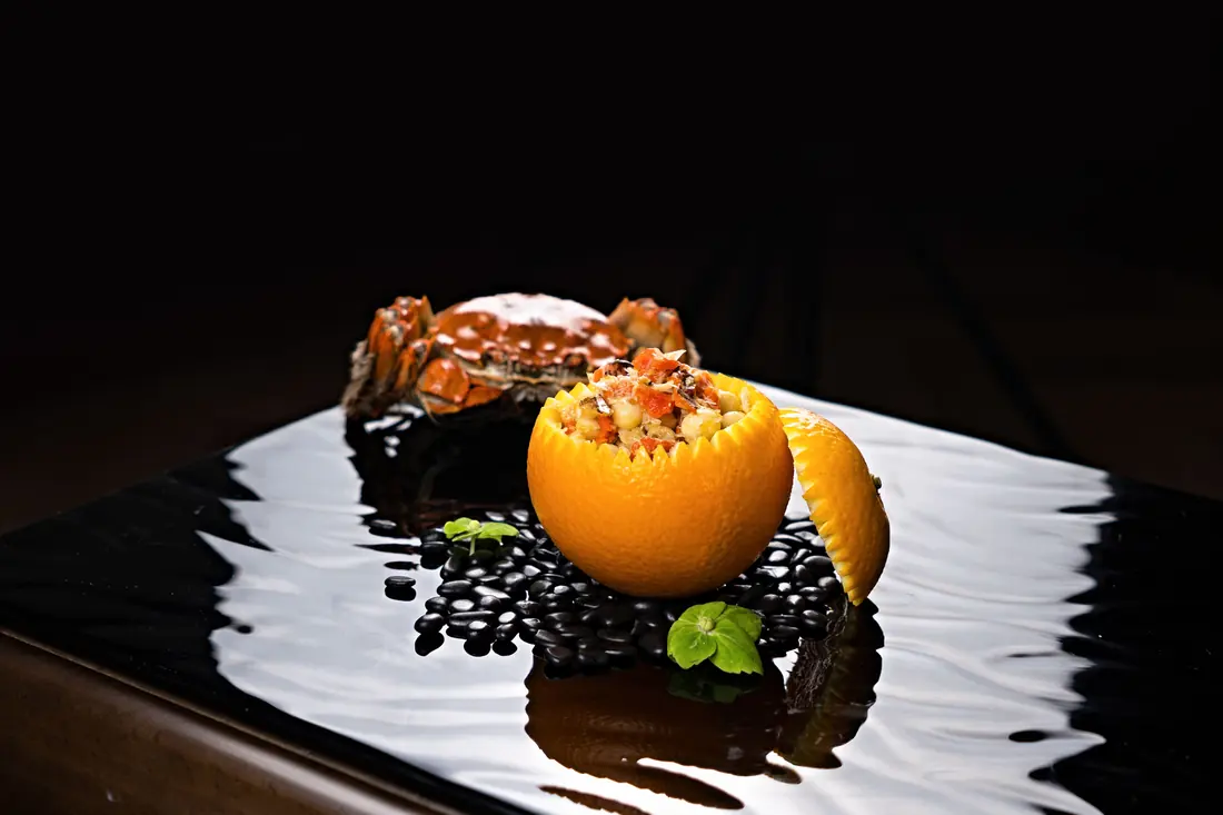A dish served in a hollowed citrus