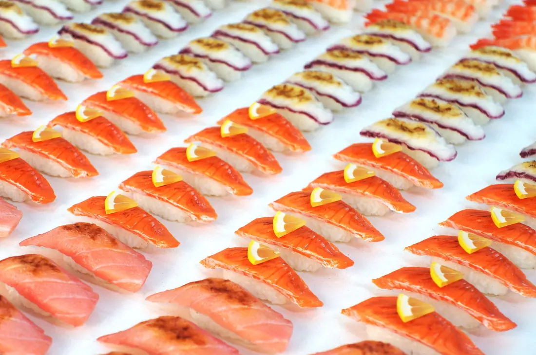 Rows of fish-topped sushi
