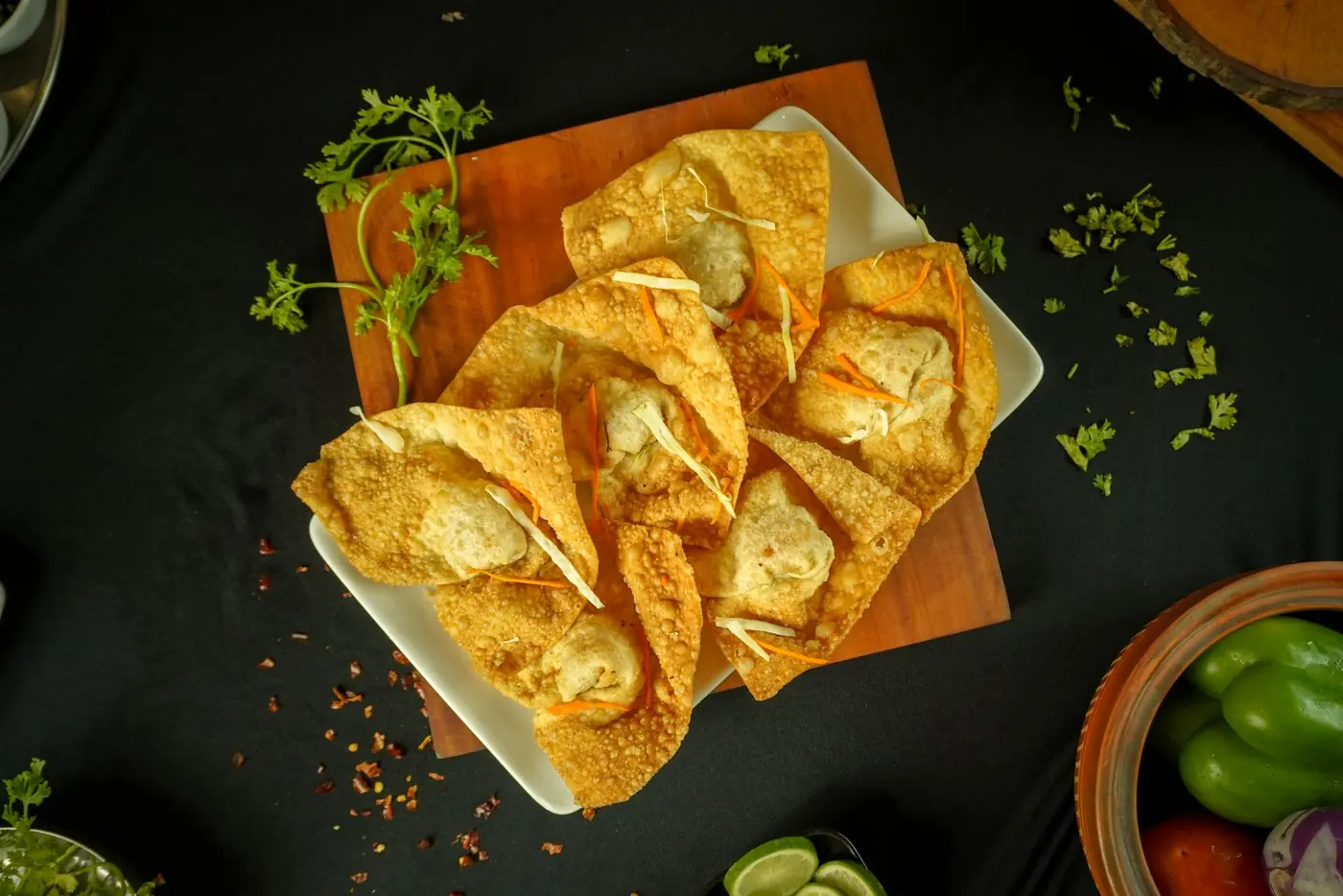 Golden fried wontons arranged on a serving plate