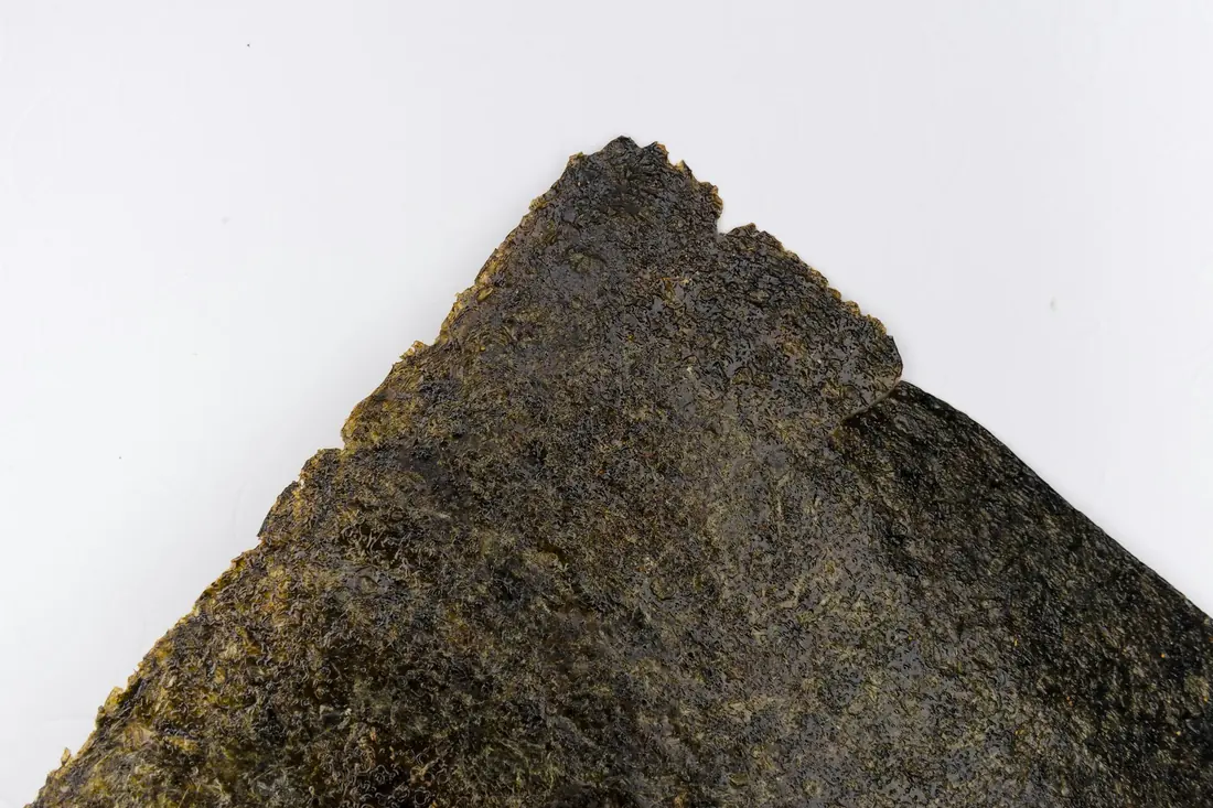 Dried nori sheets stacked close up