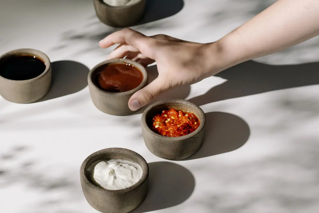 Small bowls of different sauces