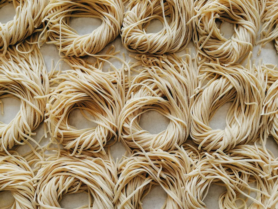 Bundles of dried wheat noodles before cooking