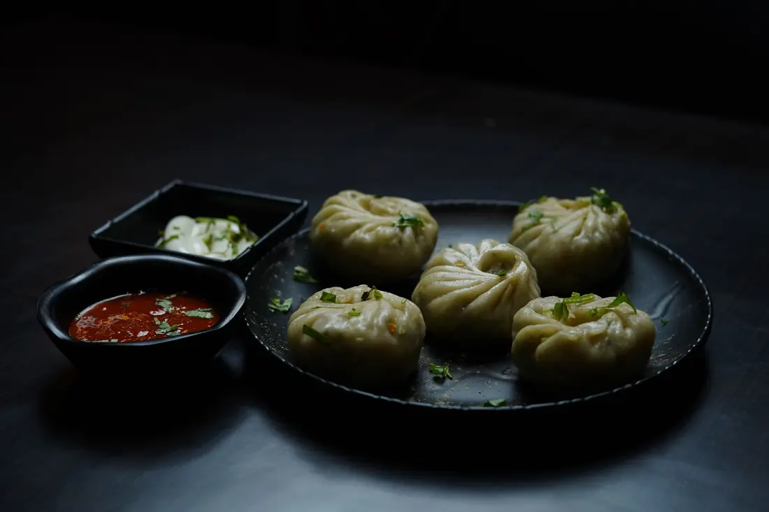 Dumplings served with two dipping sauces