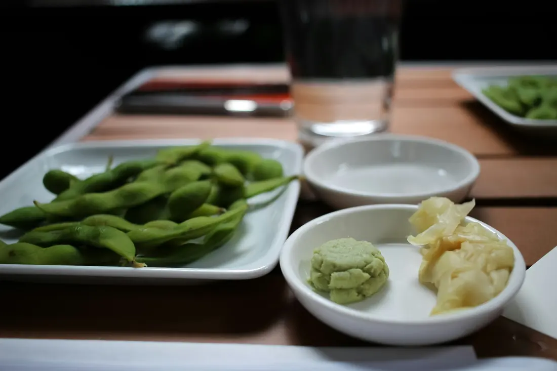 Edamame pods served on a restaurant table