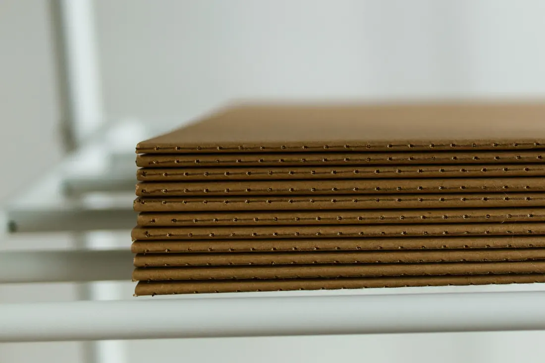 A stack of flat cardboard sheets