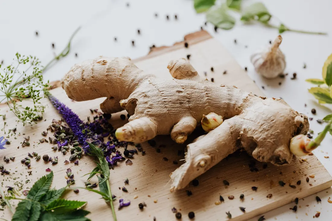Fresh ginger root on a wooden board