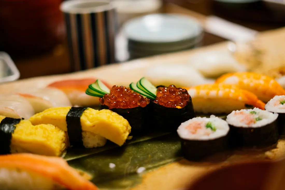 Freshly made sushi presented on a wooden board