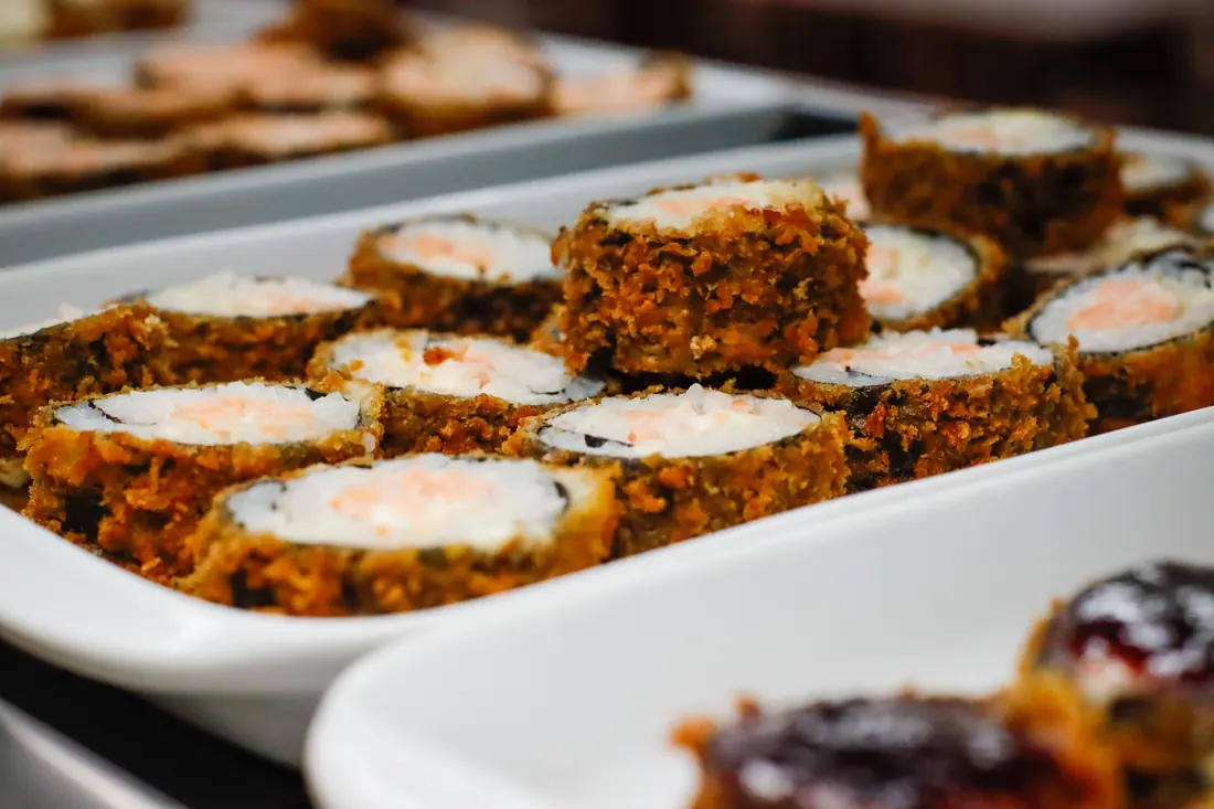 Crumbed roll pieces on serving trays