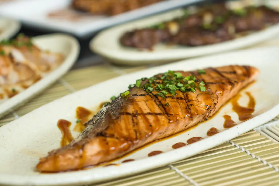 Grilled fish finished with a dark glaze