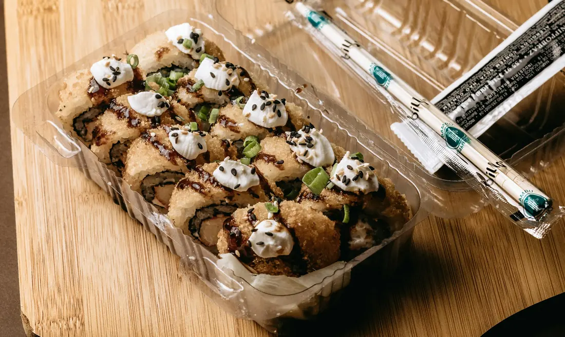 An inside-out roll coated in toasted sesame seeds