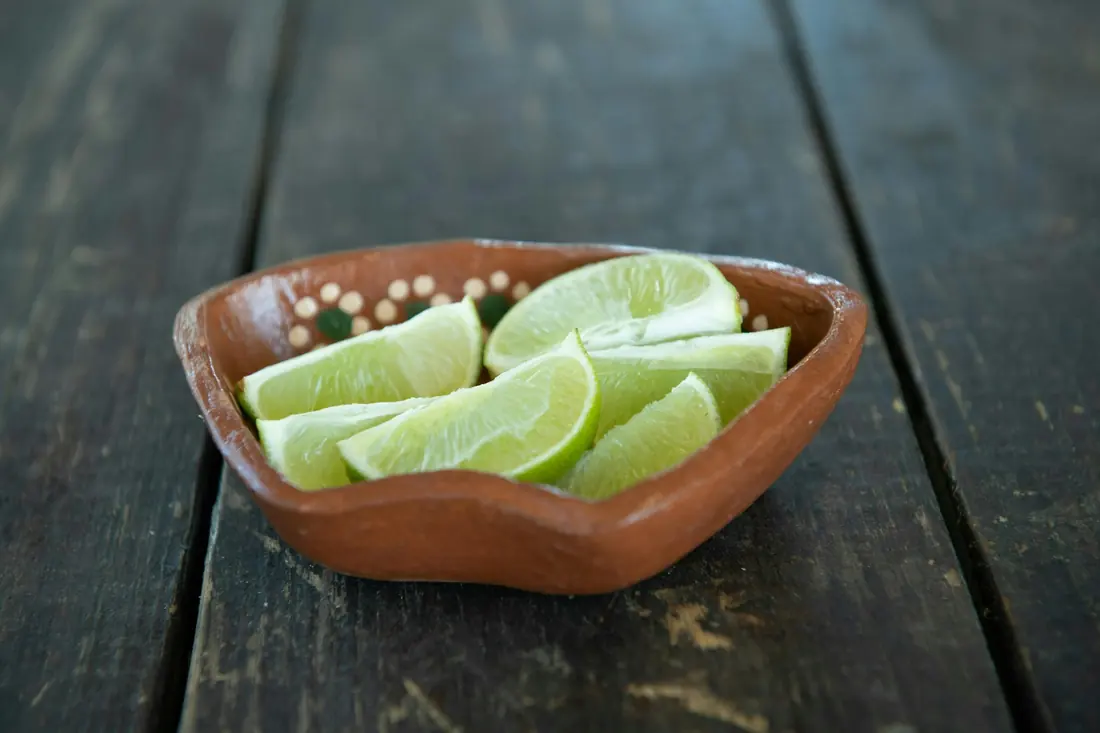 Lime wedges in a small dish