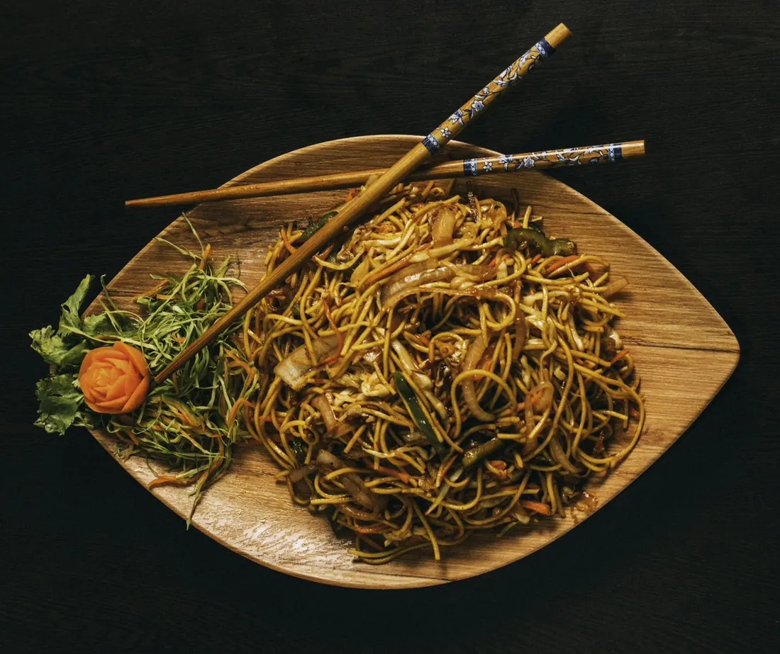 Stir-fried noodles plated on a serving dish