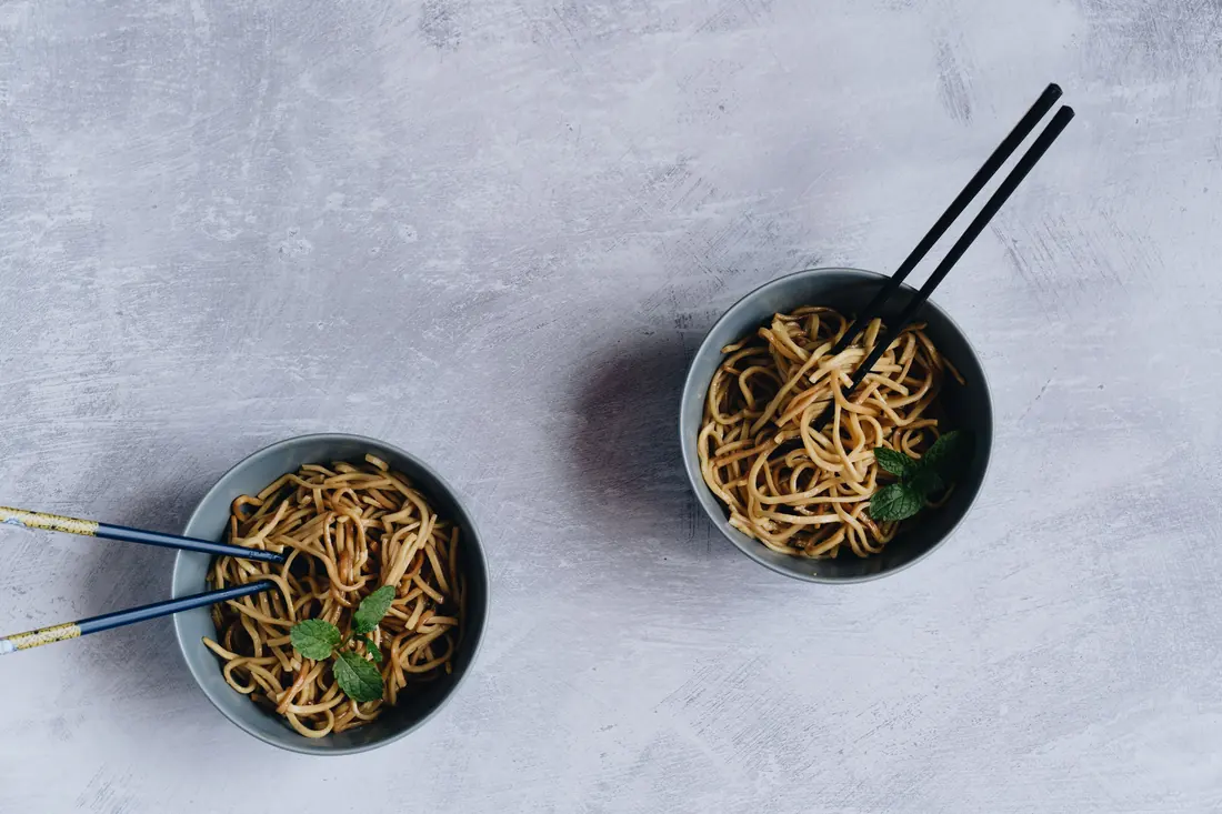 Noodles under a pale brown sauce