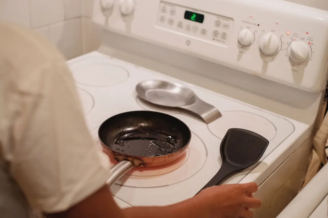 A pan heating on a stove