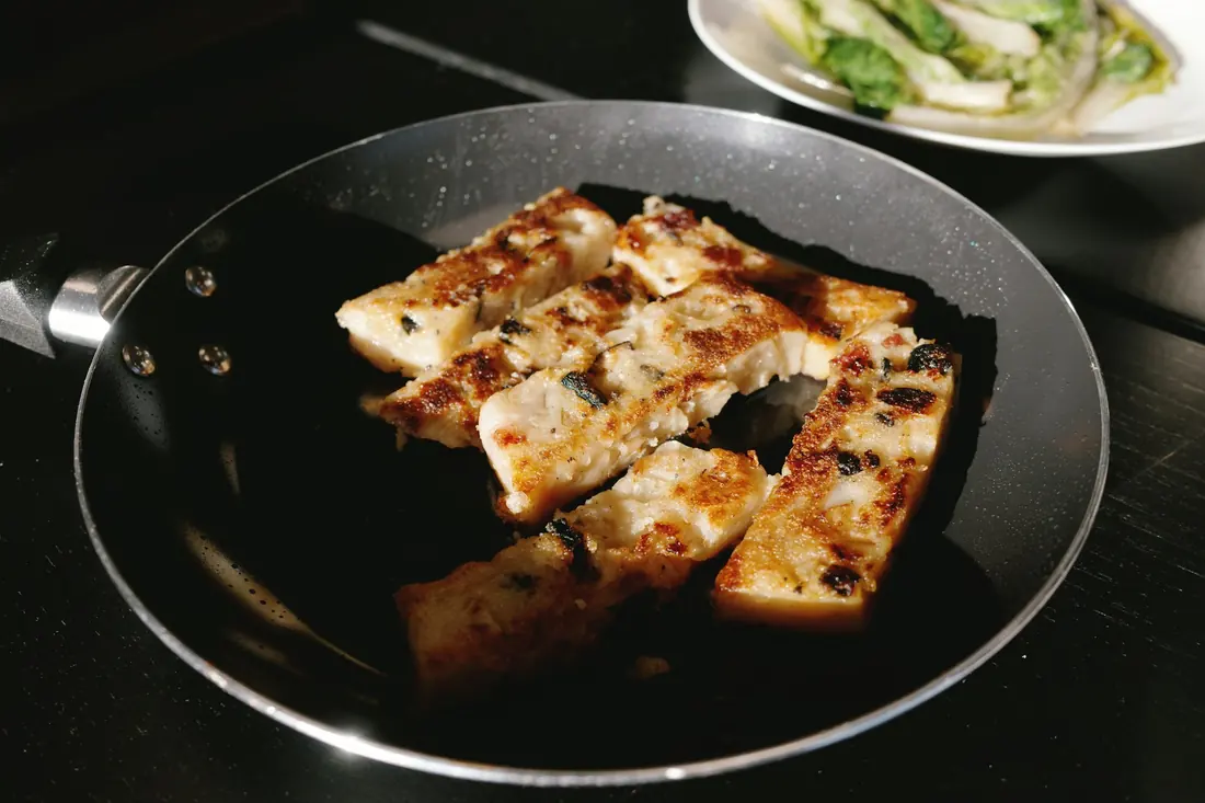 Cubes of tofu pan-fried until golden at the edges