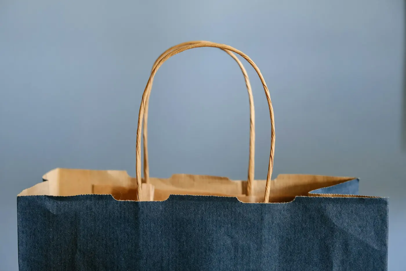 A paper takeout bag waiting for collection on a counter