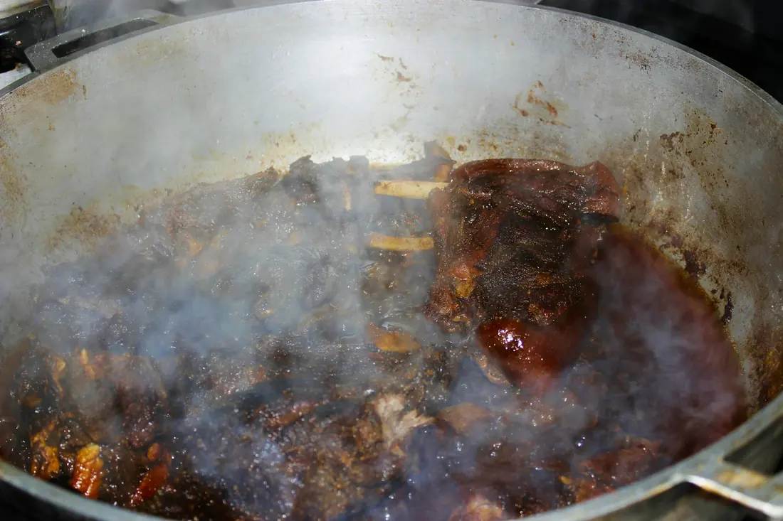 Beef bones simmering slowly in a large stockpot