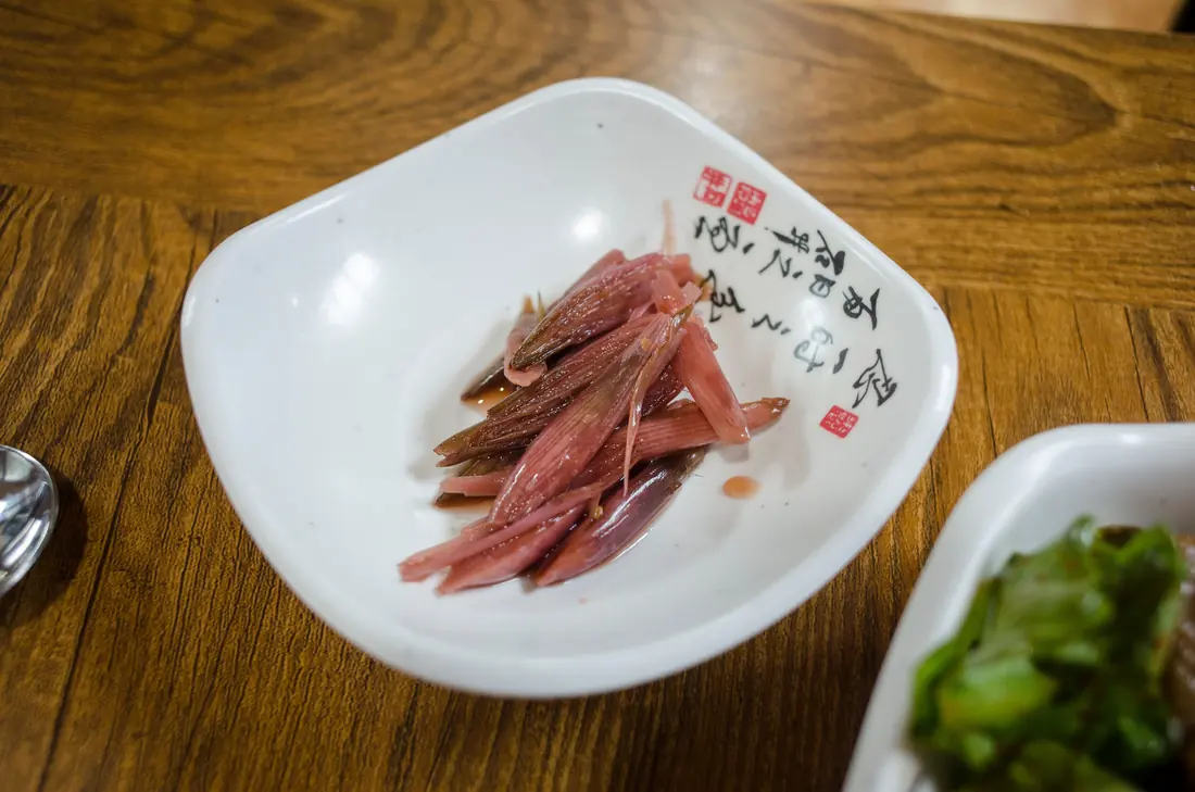 Thin slices of pink pickled ginger