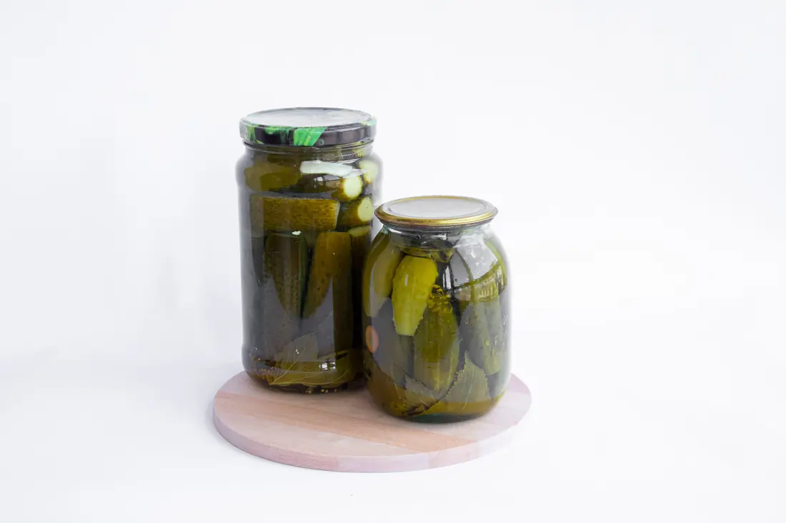 Pickles packed into glass jars