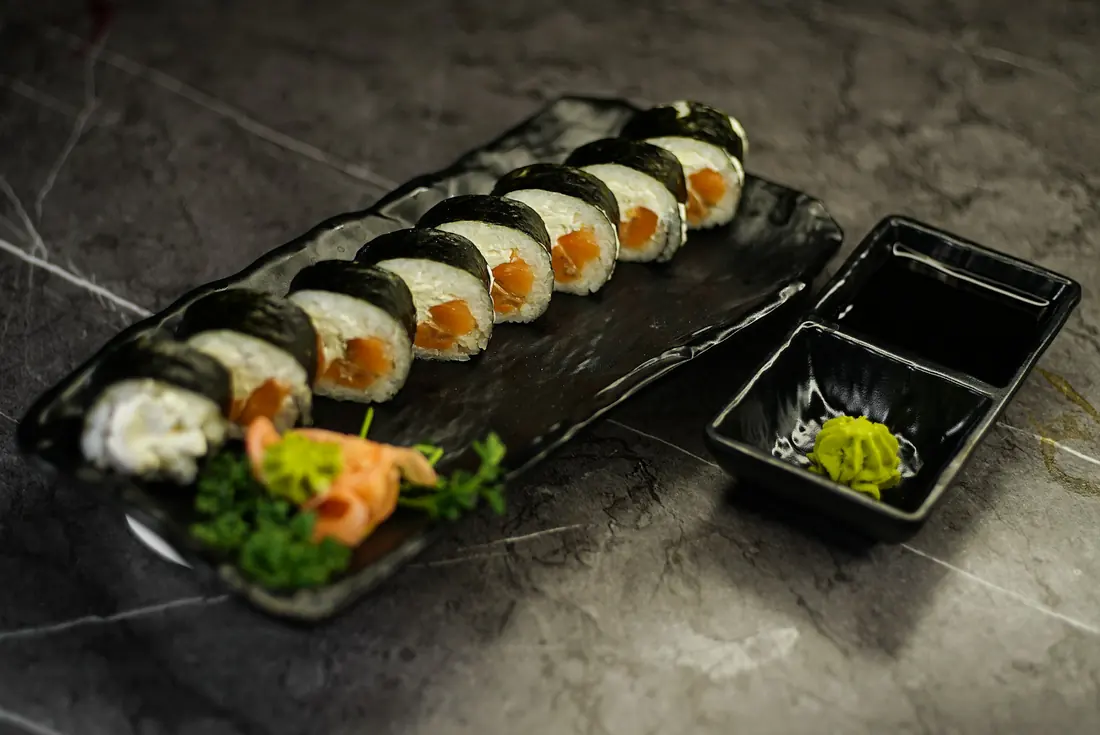 A sealed plastic tray of pre-made sushi