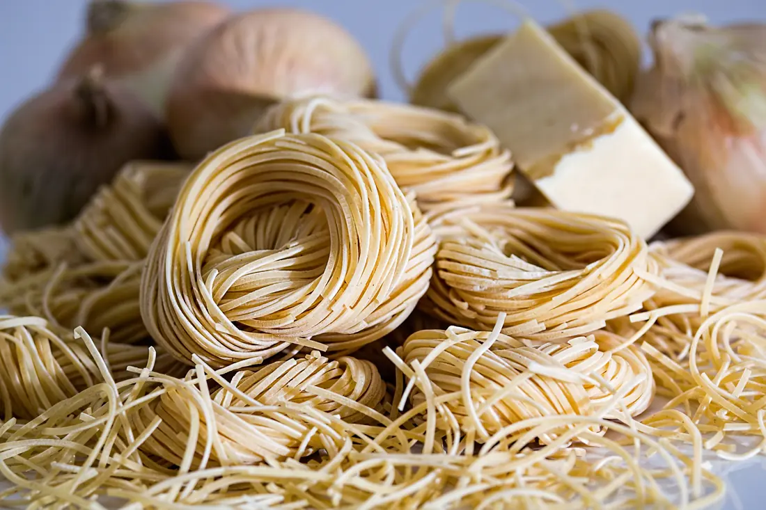 Fresh wheat noodles portioned into nests before cooking