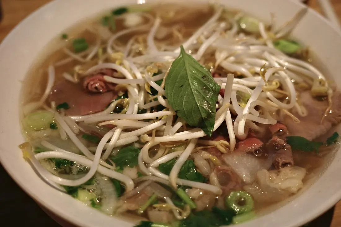 Thin slices of rare beef ready to be added to hot broth