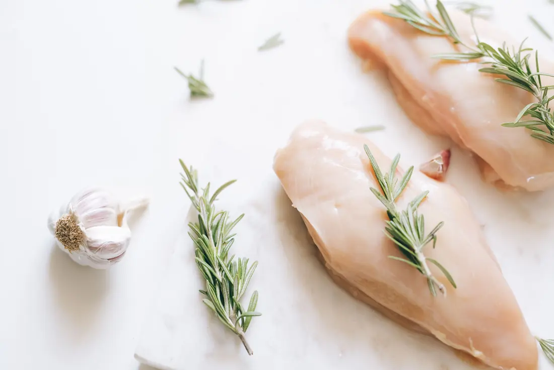 Raw chicken on a chopping board