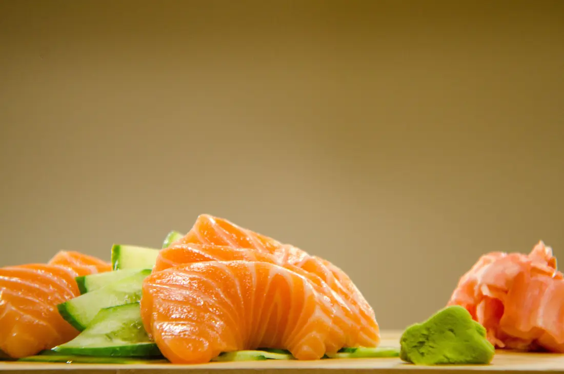 Raw fish slices with a garnish