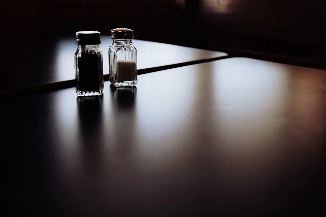 Salt and pepper shakers on a table
