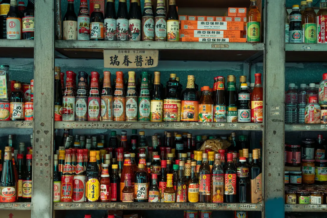 Sauce bottles standing on a shelf
