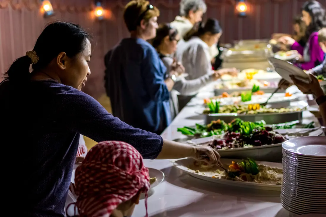 A long table set with many dishes