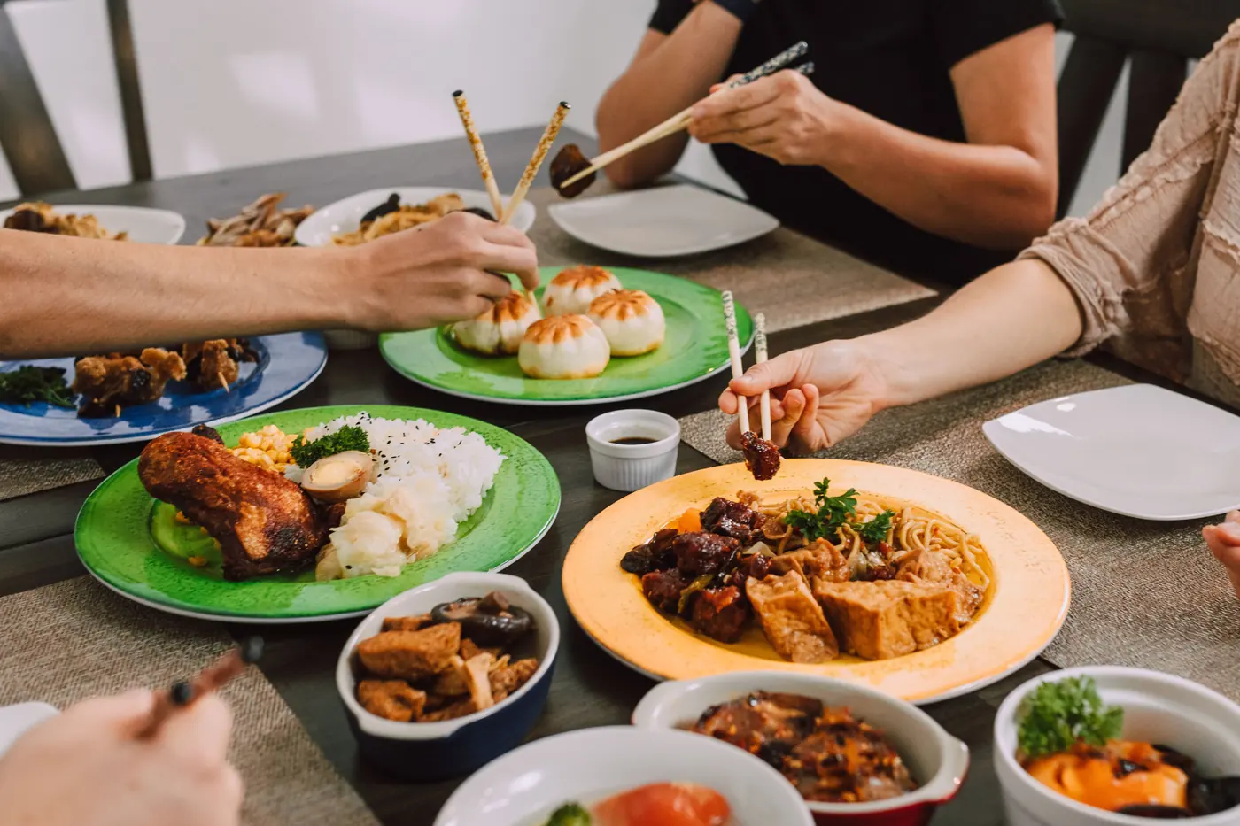 Shared dishes set out in the middle of a table