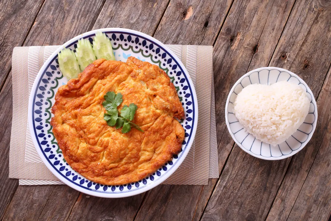 An omelette served with rice